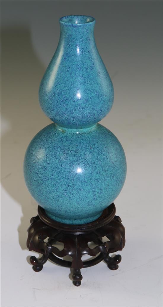 A Chinese robins egg glazed double gourd vase, late 18th century, 15.5cm, wood stand